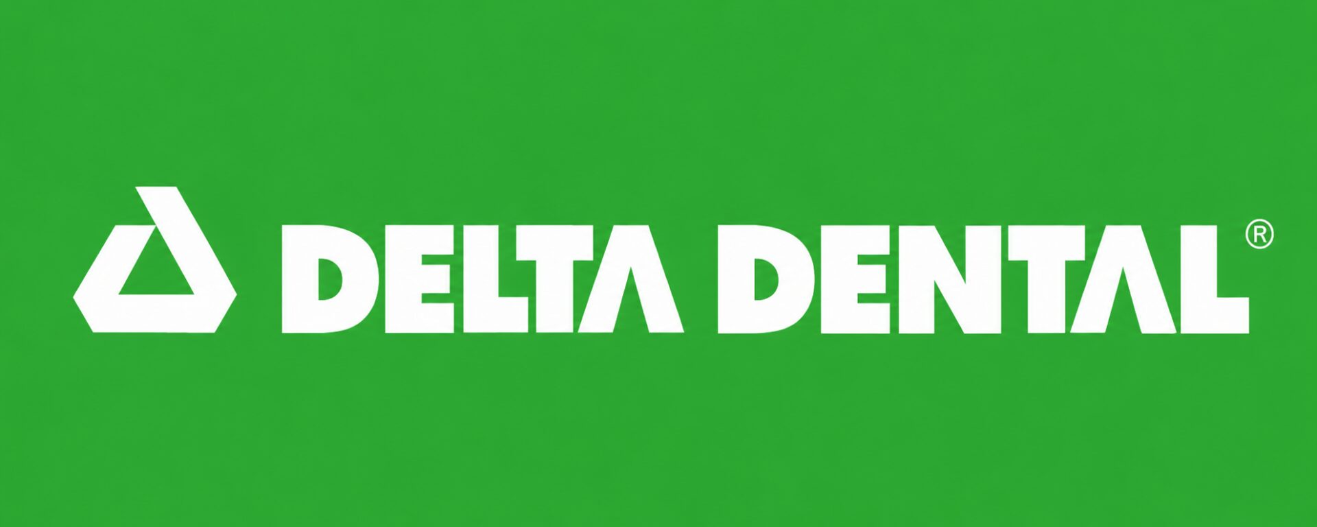 Delta Dental logo on green background.